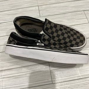 Black and grey checkered slip on Vans